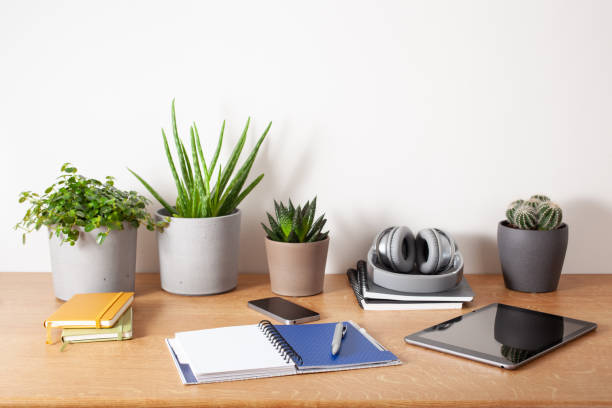 istock home office desk with tablet computer smartphone notebook houseplants, working space at home 1226401715