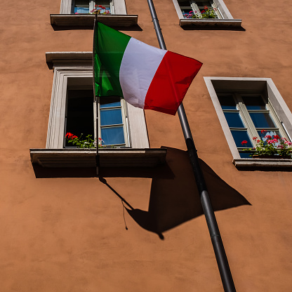 Old facades of houses with a pride flag in Venice