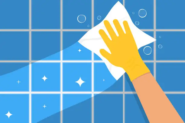 Vector illustration of Hand cleaning bathroom tile. Clean concept. Yellow gloved hand. Vector drawing.