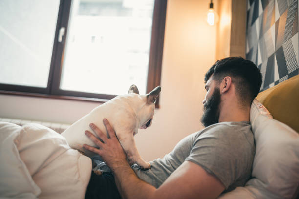 istock Young man waking up with his dog 1226405532