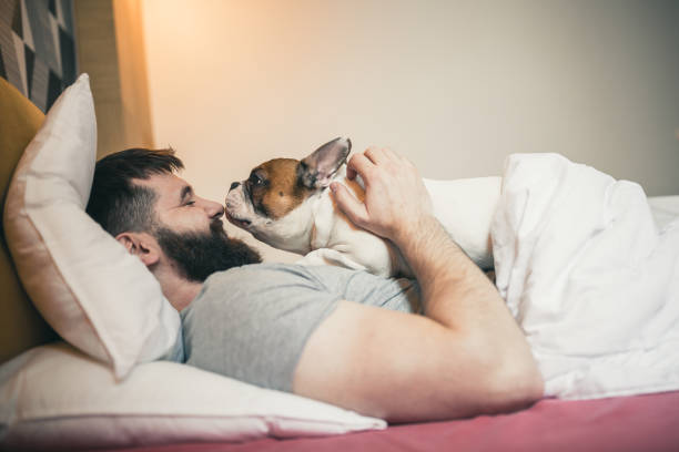 istock Young man waking up with his dog 1226405592