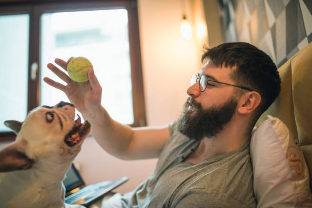 istock Young man having morning fun with his dog 1226405596