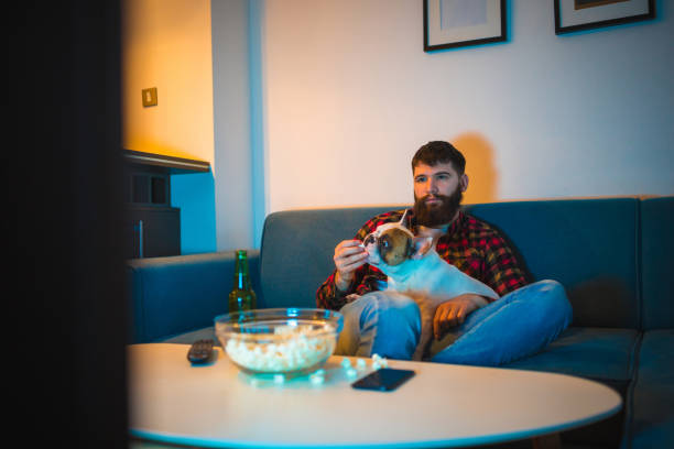 istock Watching the match with a pet 1226405670