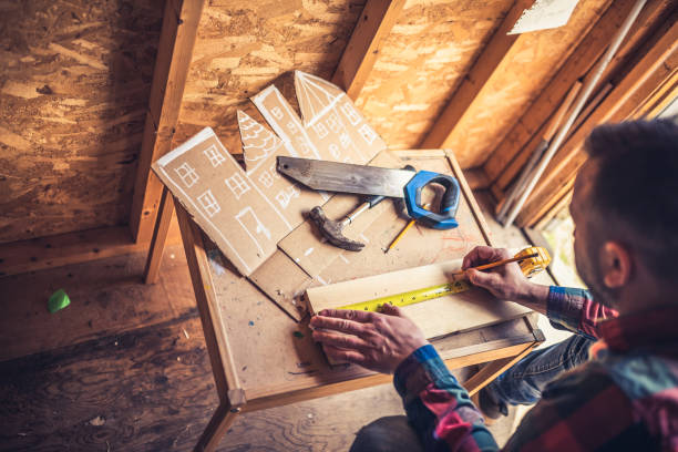 Father building a small house for his daughter