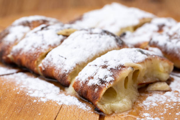 istock fruit strudel on a wooden board sprinkled with icing sugar. delicious pastries 1226408402