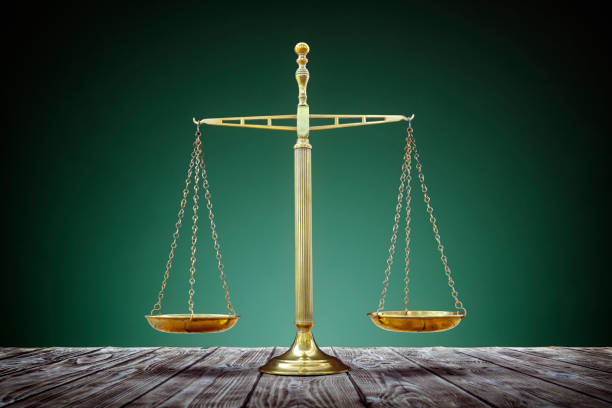 Scales of justice equality Law scales on wooden desk concept for justice and equality equal arm balance photos stock pictures, royalty-free photos & images