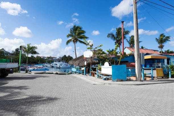 Caribbean town with coast and speedboats. Tropical destinations. Summer holidays