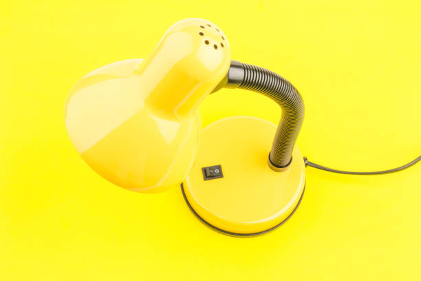 istock Yellow desk lamp isolated on yellow  background 1226412046