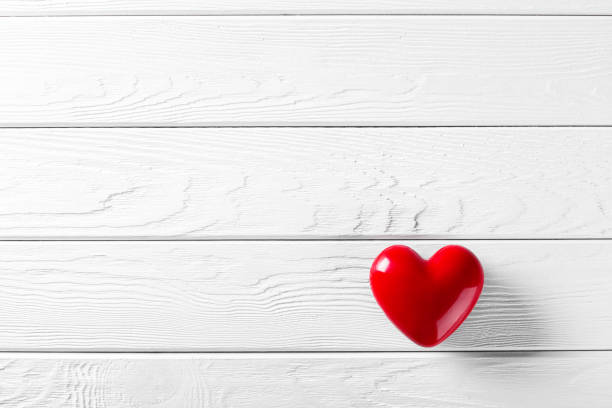 istock Red Heart shape on wooden rustic background. Valentines day celebration 1226412230