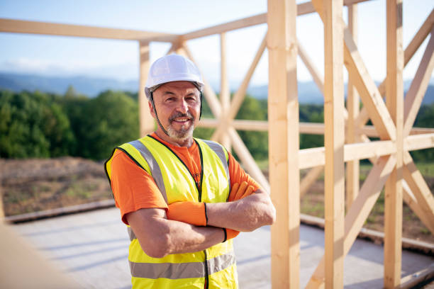 istock Portrait of construction worker in wooden construction site. 1226412330