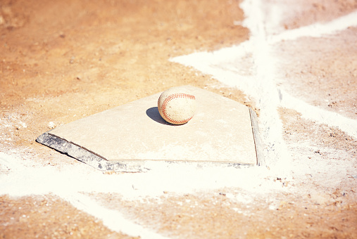 Shot of a baseball lying on a field during a match