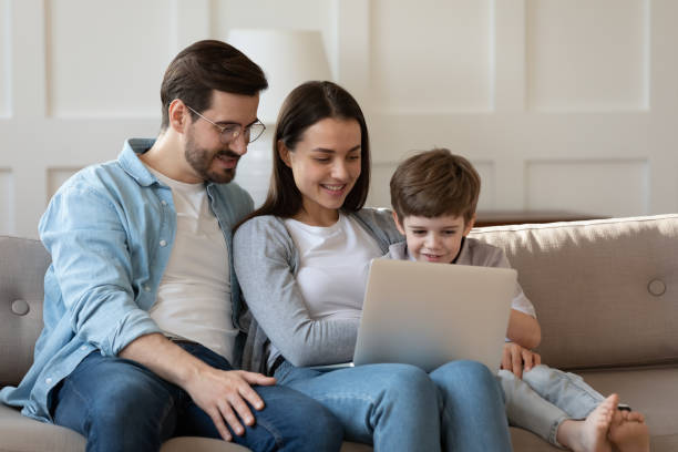 istock Young family with small son using laptop at home 1226418577