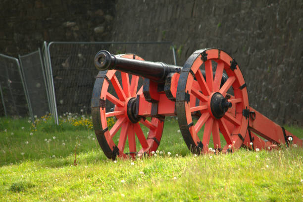 istock Red and black cannon and gun carriage 1226418659