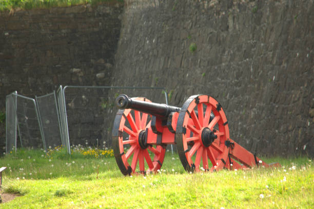 istock Red and black cannon and gun carriage 1226418971