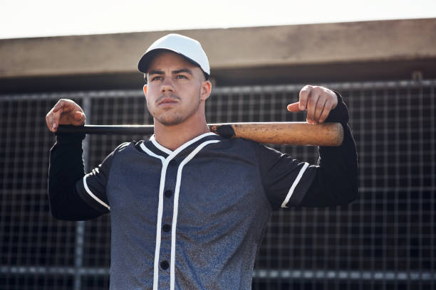 give your best to every game - men baseball cap focus determination imagens e fotografias de stock