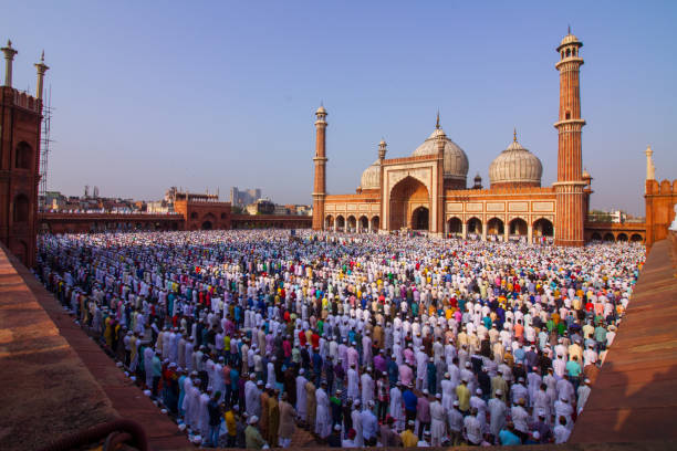 eid at delhi jama masjid A huge crowd seen performing namaz on the occasion of Eid-ul-Fitr. salah islamic prayer photos stock pictures, royalty-free photos & images