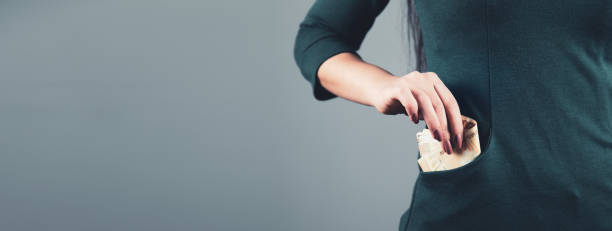 istock woman hand money on pocket 1226423338