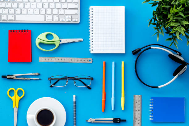 istock Education Online School Concept. Keyboard, stationery on blue table from above flat lay pattern 1226423430