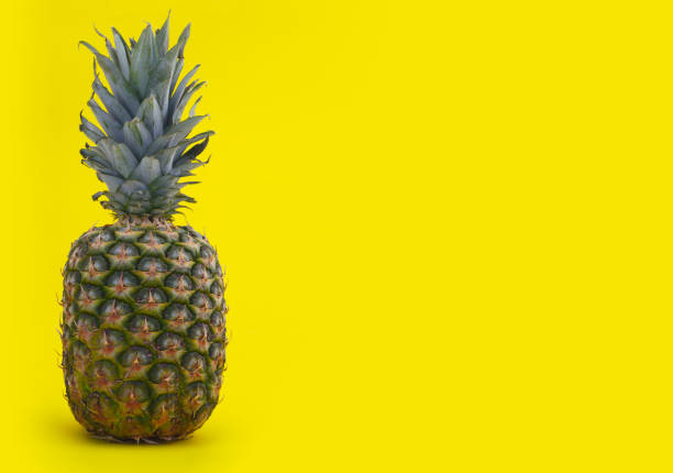 istock pineapple tropical fruit on yellow background organic exotic fresh food 1226424551