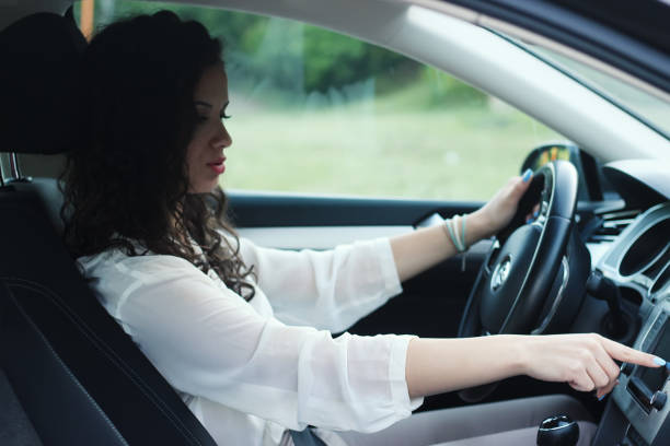 istock Businesswoman driving car 1226424786