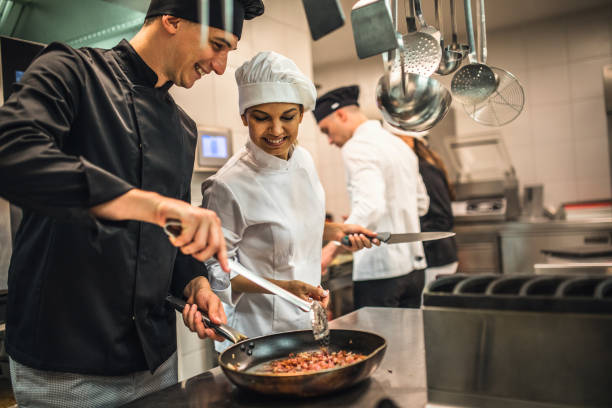 The team of cooks backs in the work in the modern kitchen,
