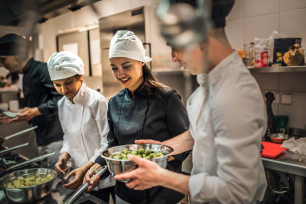 istock The team of cooks backs in the work in the modern kitchen, 1226427289