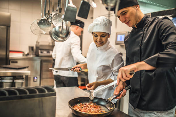 istock The team of cooks backs in the work in the modern kitchen, 1226427298