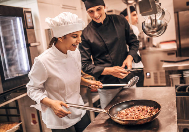 istock The team of cooks backs in the work in the modern kitchen, 1226427345