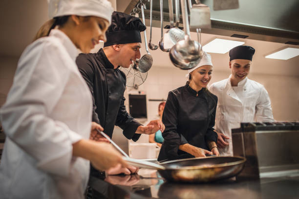 istock The team of cooks backs in the work in the modern kitchen, 1226427502