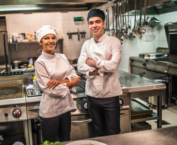 istock The team of cooks backs in the work in the modern kitchen, 1226427526