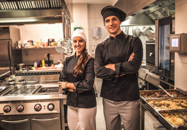 istock The team of cooks backs in the work in the modern kitchen, 1226427557