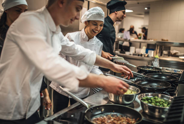 istock The team of cooks backs in the work in the modern kitchen, 1226427644