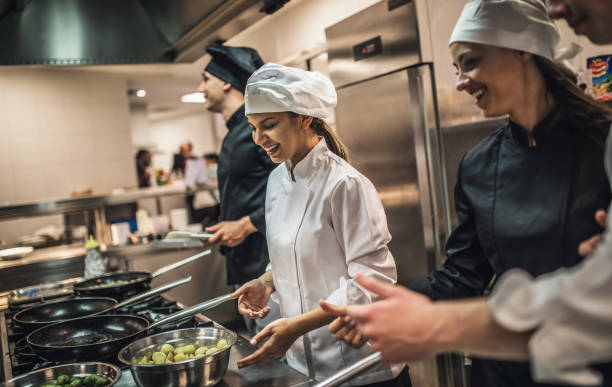 istock The team of cooks backs in the work in the modern kitchen, 1226427931