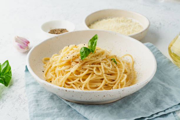 Cacio e pepe pasta. Spaghetti with parmesan cheese and pepper. stock photo