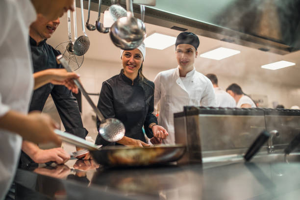 istock The team of cooks backs in the work in the modern kitchen, 1226428553