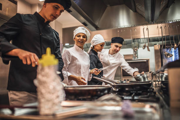istock The team of cooks backs in the work in the modern kitchen, 1226428562