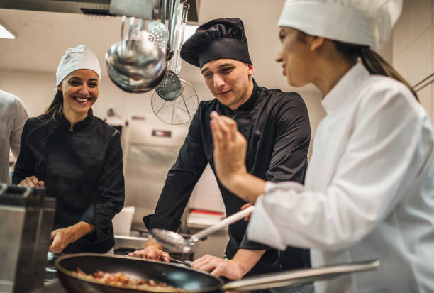 istock The team of cooks backs in the work in the modern kitchen, 1226428572