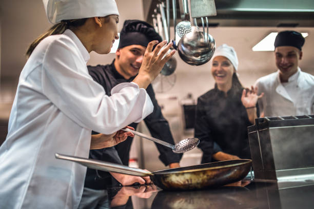 istock The team of cooks backs in the work in the modern kitchen, 1226428582