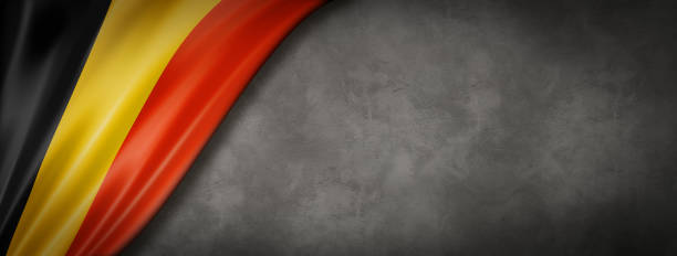 istock Belgian flag on concrete wall banner 1226428586