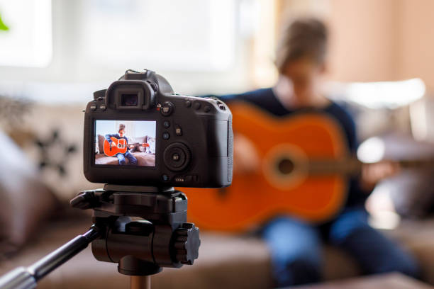 istock Acoustic guitar lesson, video in progress 1226430027
