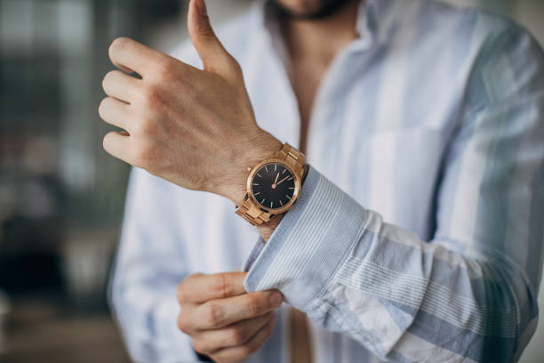 istock Modern man with gold wristwatch 1226432020