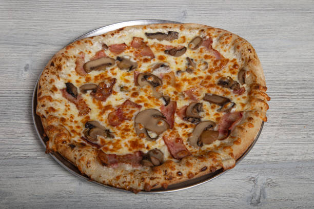 istock Artisan carbonara pizza isolated on wooden background. Menu card image 1226435346