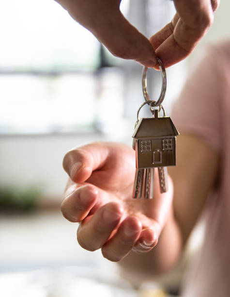 Giving keys to new house owner