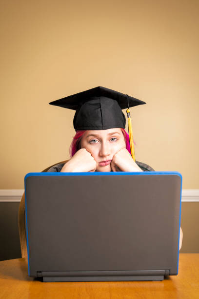 istock Girl Sad About Virtual Graduation 1226436842