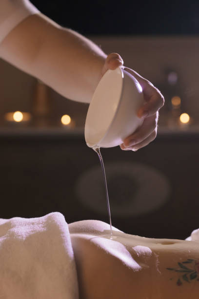 istock Beautiful girl doing wellness procedures with coconut oil on her stomach 1226437708