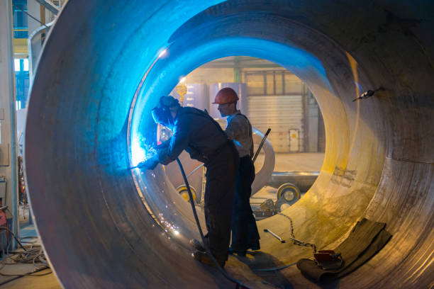 istock Two welders work in a pipe for an oil pipeline. 1226439297