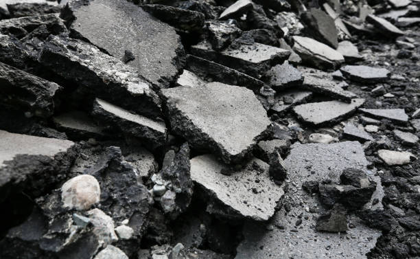 istock Repaving work. Asphalt pieces, pieces of broken asphalt, repairs 1226444611