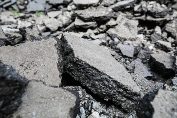 istock Repaving work. Asphalt pieces, pieces of broken asphalt, repairs 1226444655
