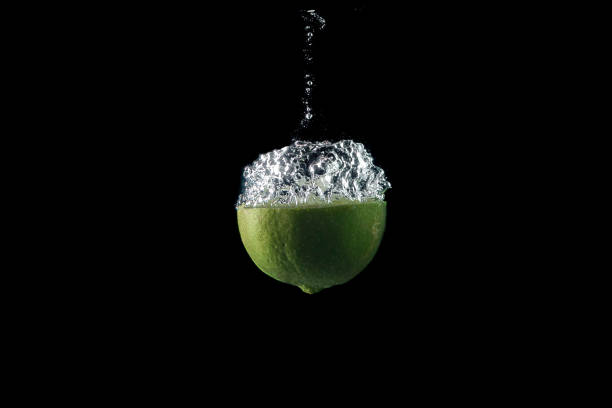 lemon entering the water and splashing