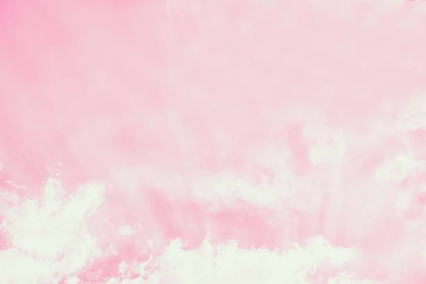 istock Light delicate pink sky background. Beautiful romantic sky with white clouds 1226445094
